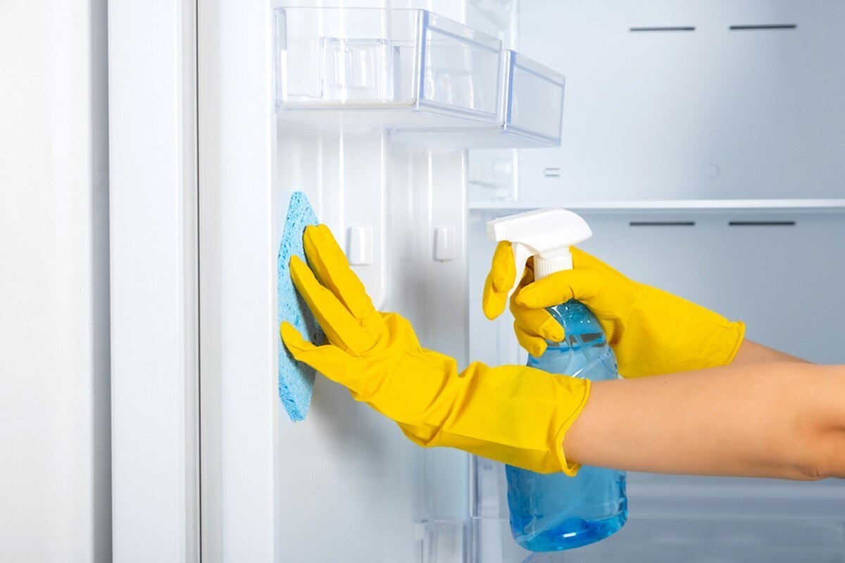 Clean inside of refrigerator thoroughly with a damp microfiber cloth 